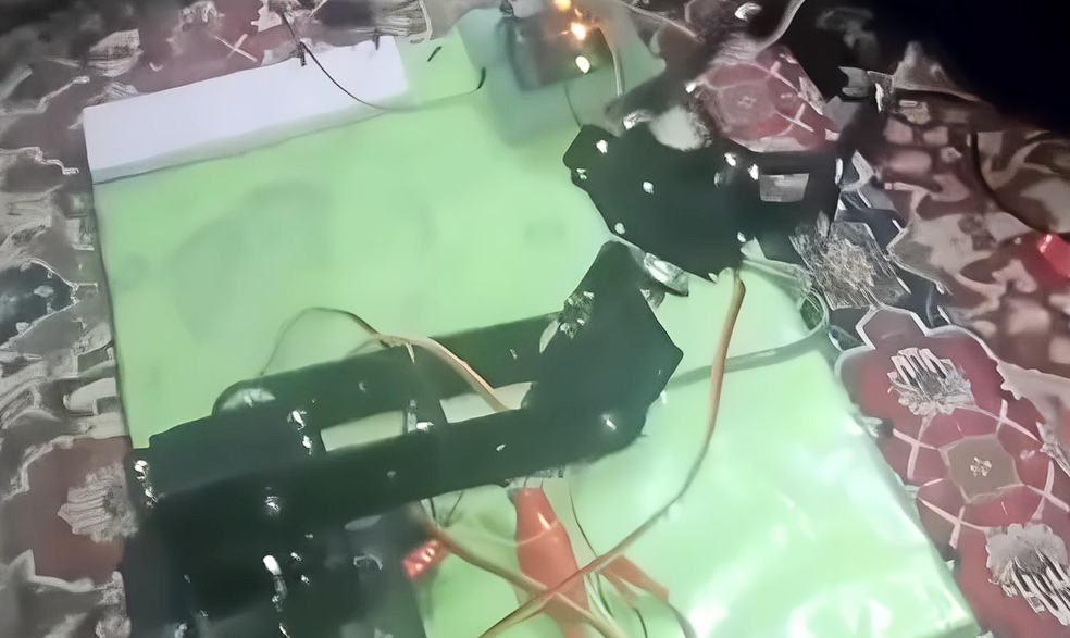Robotic arm end-effector gripper in the open position